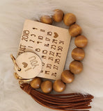 Beaded Wristlet with Date Charm and Tassel